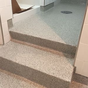 Epoxy flooring installed in locker room shower